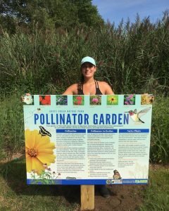 Bri With Pollinator Garden Sign